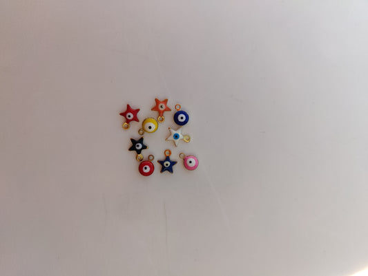 Colorful stainless steel charms for jewelry customization, featuring stars and circular designs.