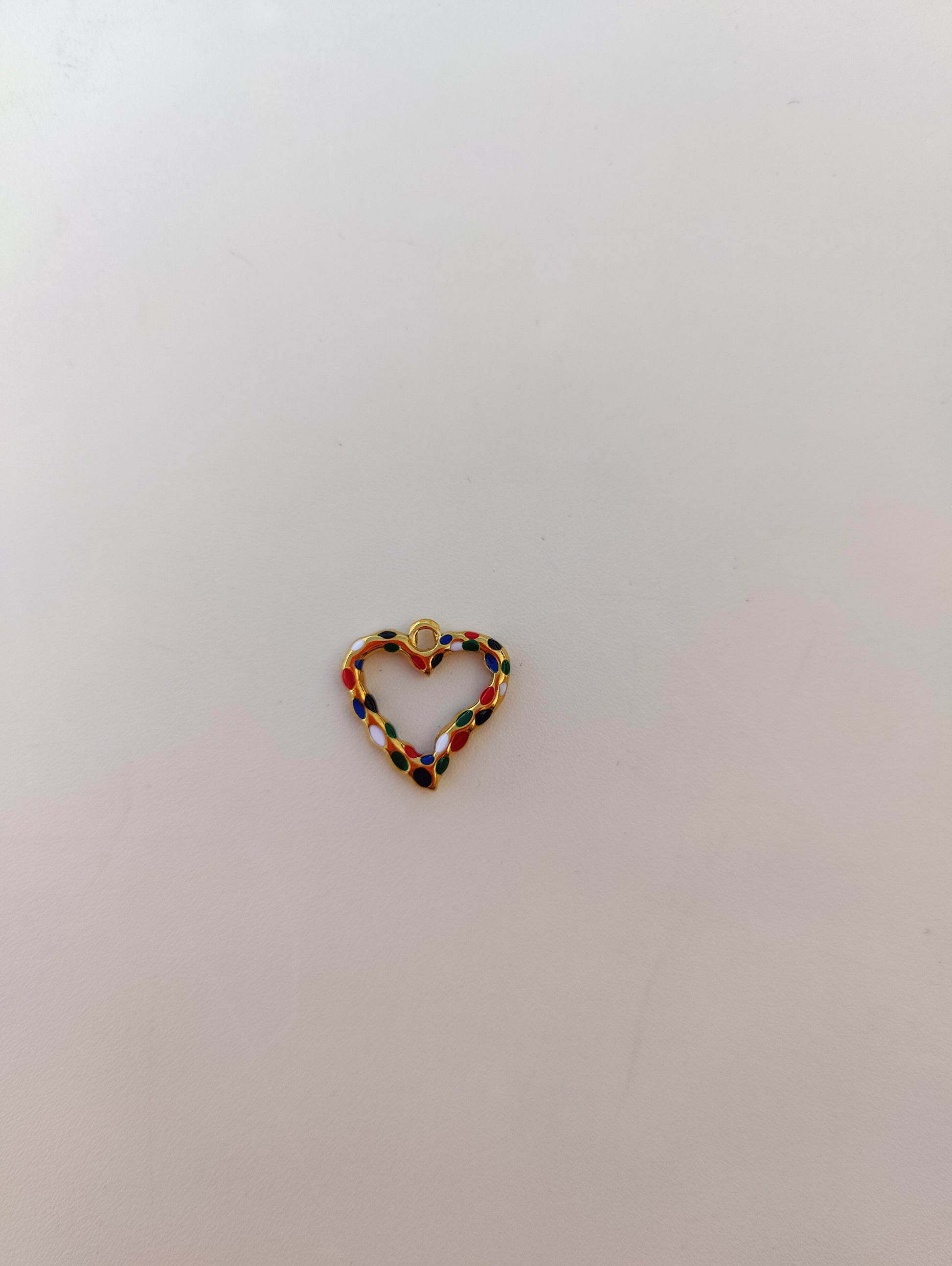 Colorful heart charm with a decorative design for personalized jewelry.
